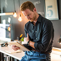 Young businessman with tablet.